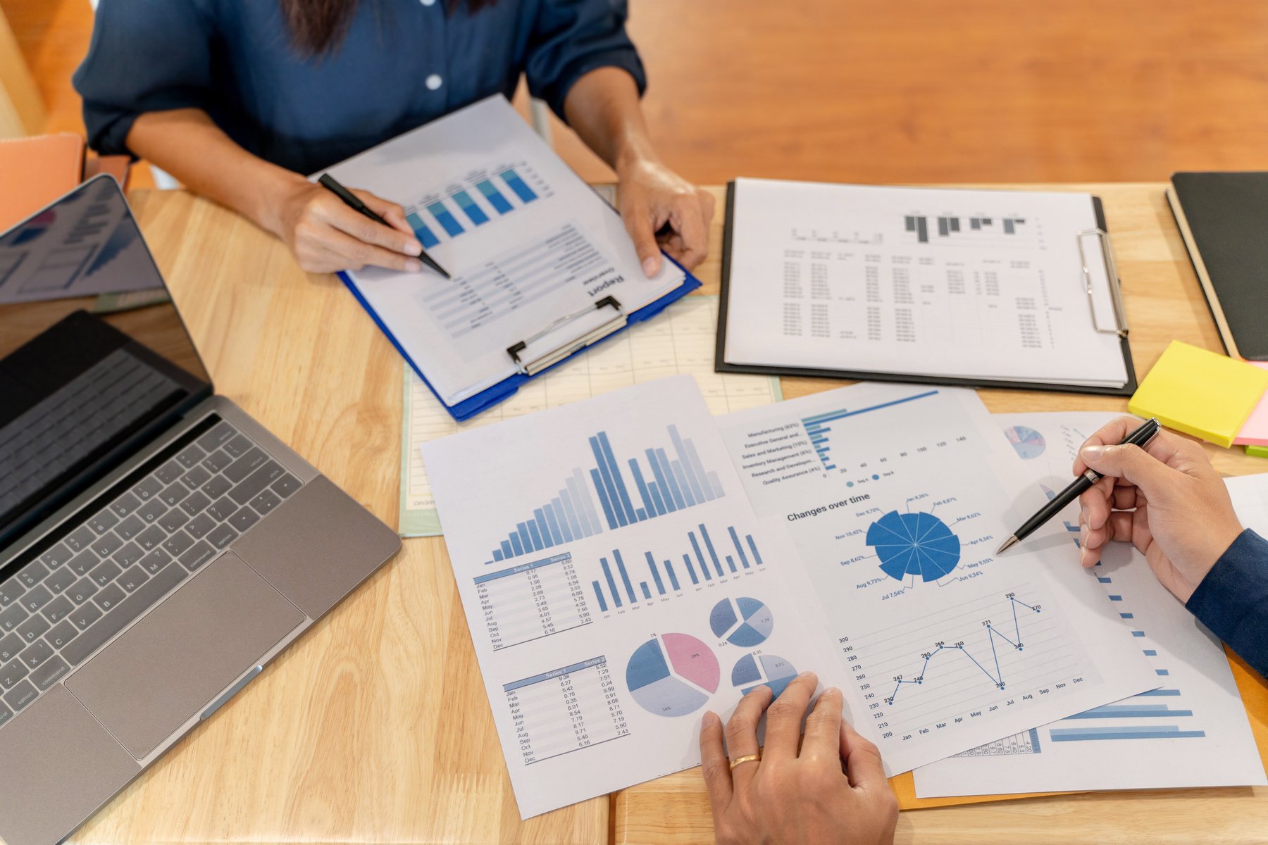 Financial auditor meeting analyzing a valuation of investment da